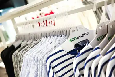 Sustainable hanger features recycled chipboard and reusable hook