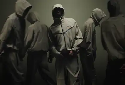 Nike plays up weaving in track suits